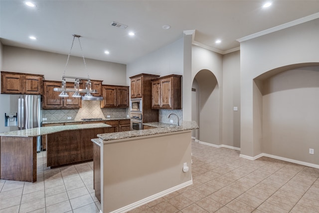 kitchen featuring pendant lighting, light stone counters, tasteful backsplash, kitchen peninsula, and crown molding