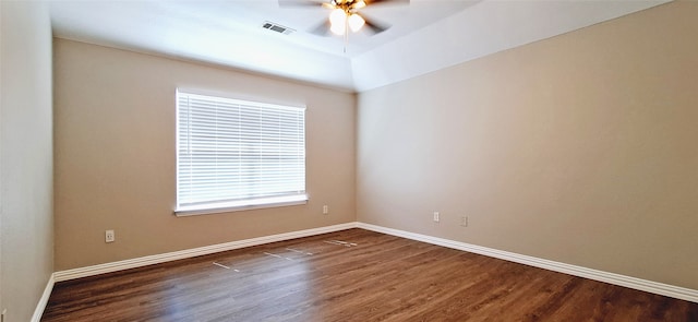 unfurnished room featuring ceiling fan and dark wood-type flooring