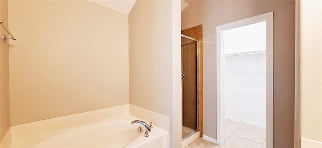 bathroom featuring shower with separate bathtub and tile patterned floors