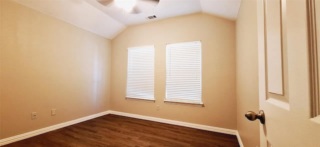 unfurnished room with vaulted ceiling, ceiling fan, and dark wood-type flooring