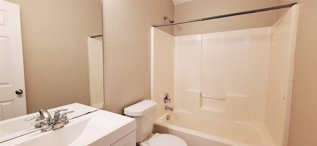 full bathroom with washtub / shower combination, vanity, and toilet