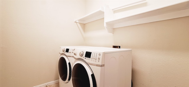 laundry area featuring independent washer and dryer