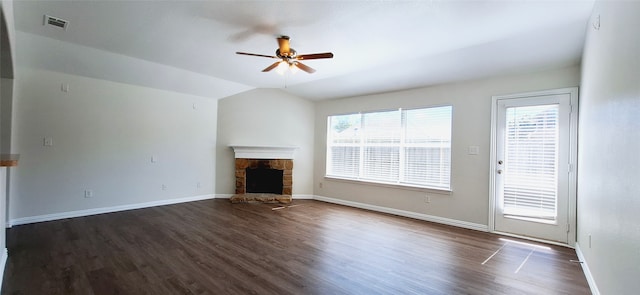 unfurnished living room with vaulted ceiling, ceiling fan, a fireplace, and dark hardwood / wood-style flooring