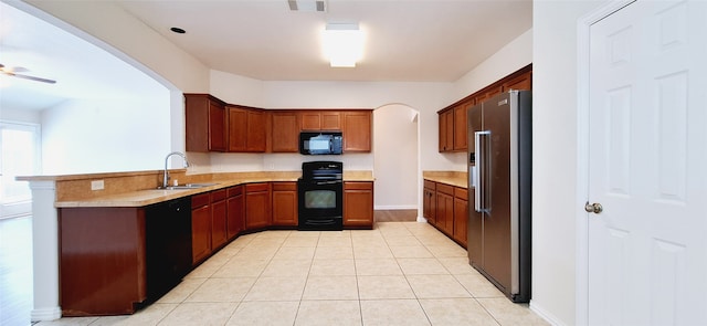 kitchen with ceiling fan, light tile patterned floors, sink, kitchen peninsula, and black appliances