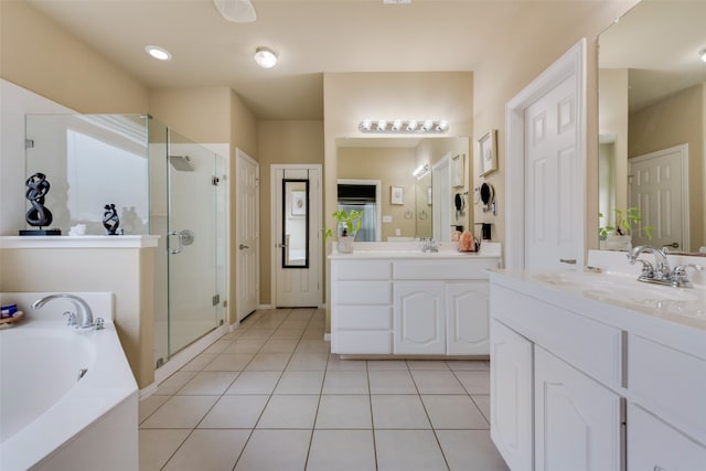 bathroom with independent shower and bath, tile patterned flooring, and vanity