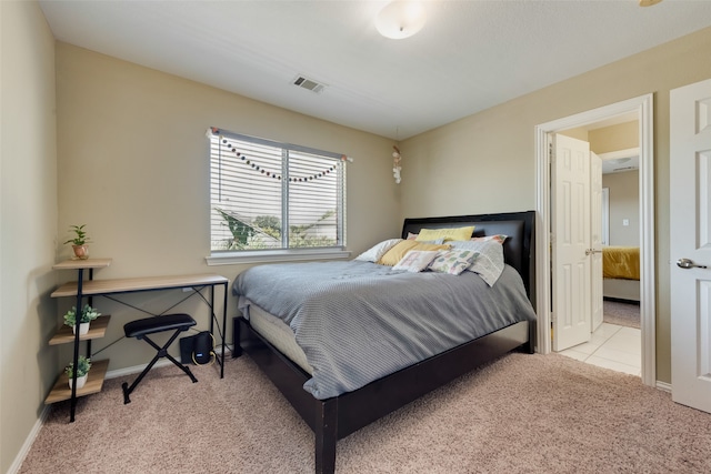 bedroom featuring light carpet