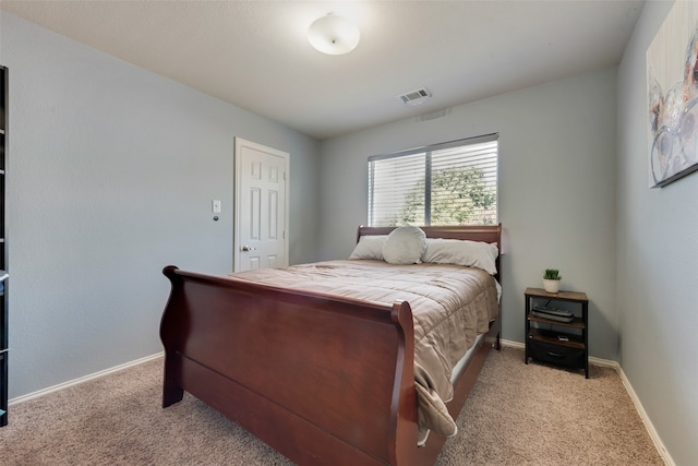 bedroom with light colored carpet