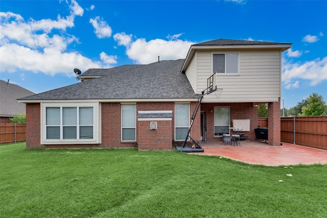 rear view of property featuring a lawn and a patio area