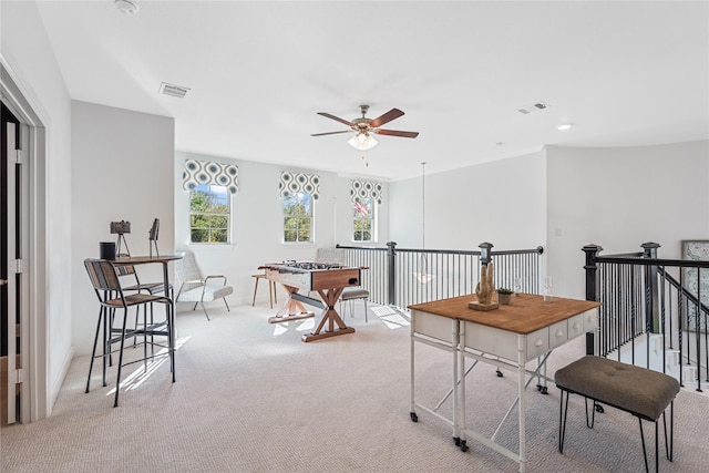 game room featuring ceiling fan and light colored carpet