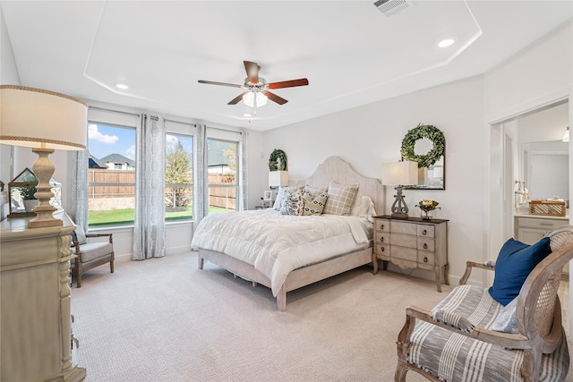 bedroom with ceiling fan and light carpet