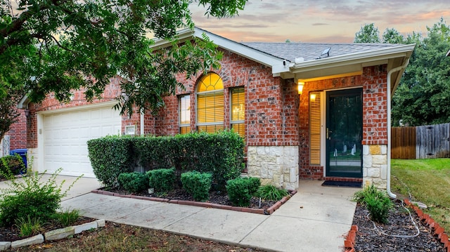 single story home featuring a garage