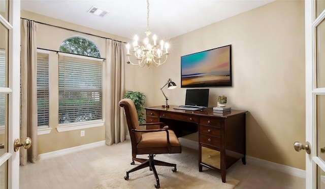 home office featuring a chandelier