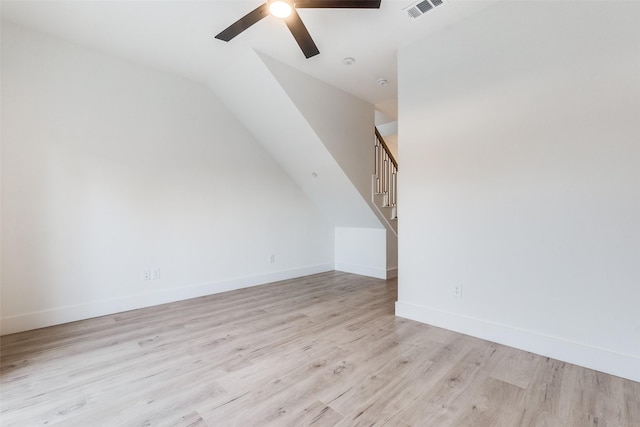 bonus room with light wood-type flooring, ceiling fan, and lofted ceiling