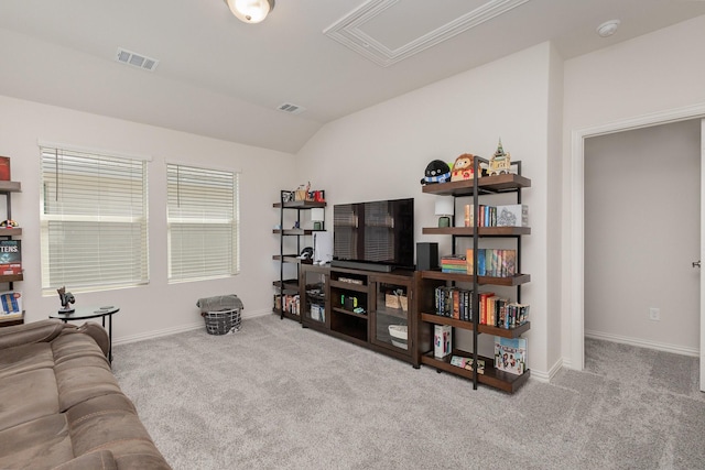 carpeted living room featuring vaulted ceiling