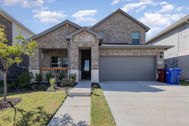 view of front of property with a porch, a garage, and a front lawn