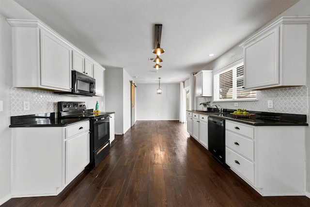 kitchen featuring sink, white cabinets, dark wood-type flooring, and black dishwasher