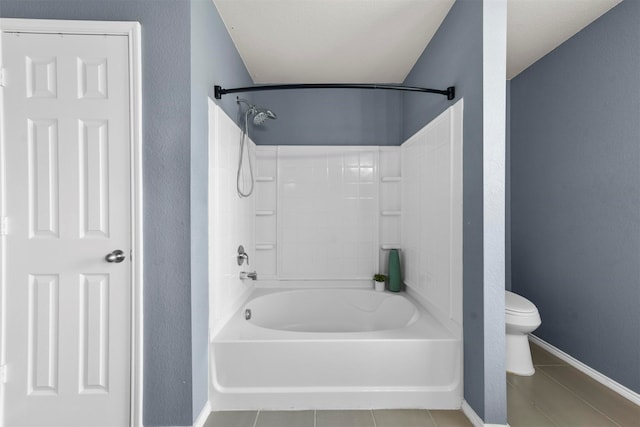 bathroom with tile patterned floors, toilet, and shower / bath combination