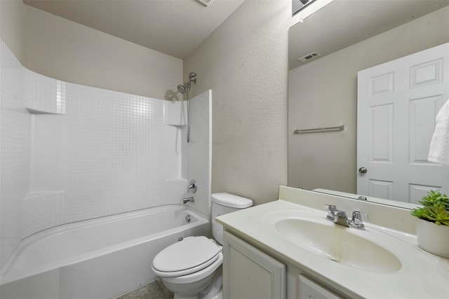 full bathroom with shower / bathing tub combination, vanity, a textured ceiling, and toilet