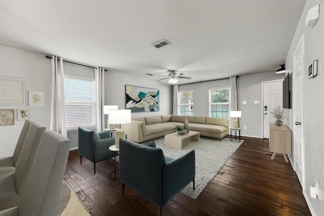 spare room with ceiling fan and dark wood-type flooring