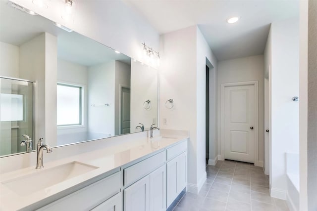 bathroom featuring vanity, tile patterned floors, and a shower with door