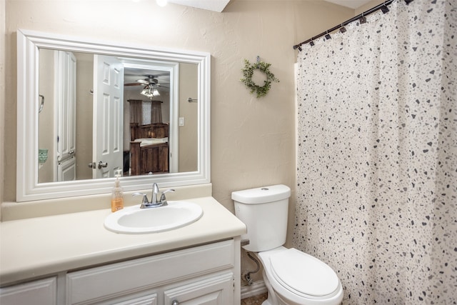 bathroom with ceiling fan, vanity, and toilet