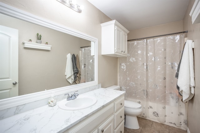 full bathroom featuring shower / bath combo, tile patterned flooring, vanity, and toilet