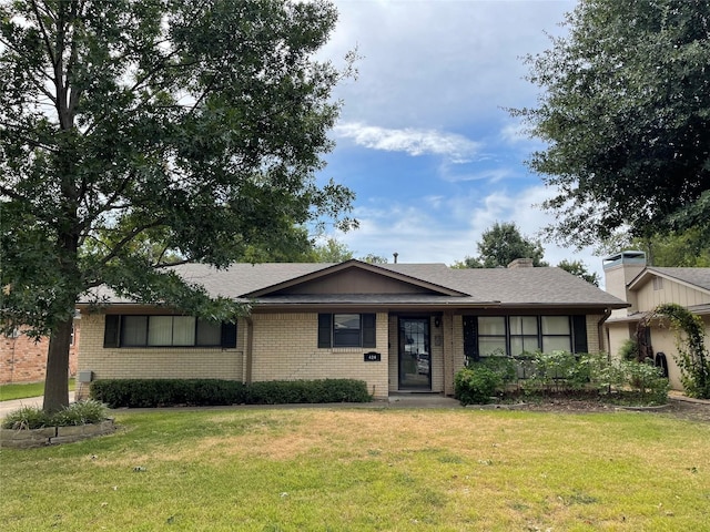 ranch-style house with a front lawn