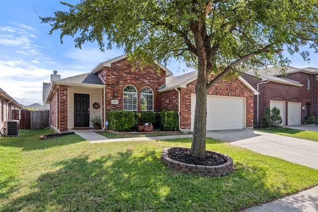 view of front of home featuring cooling unit, a front lawn, and a garage