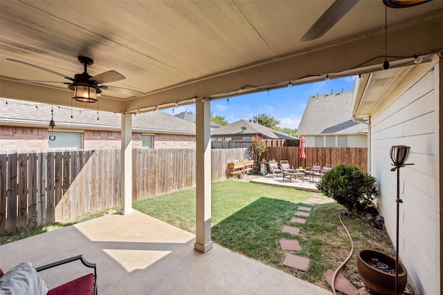 view of patio featuring ceiling fan and a fenced backyard