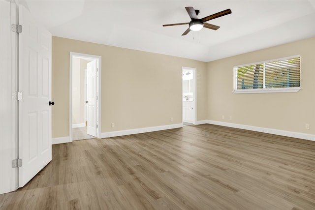 spare room with light hardwood / wood-style floors and ceiling fan