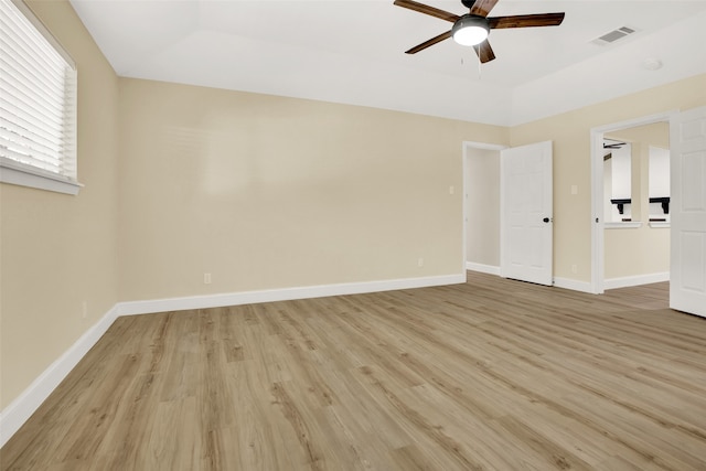 spare room featuring light hardwood / wood-style floors and ceiling fan