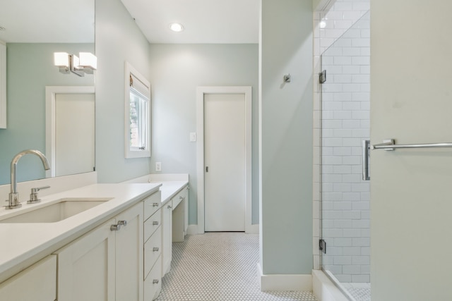 bathroom with vanity, tile patterned floors, and a shower with shower door