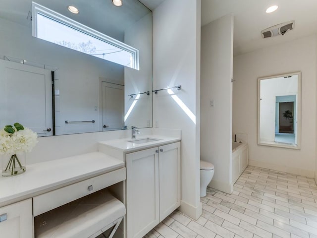 full bath featuring recessed lighting, visible vents, toilet, vanity, and a bath