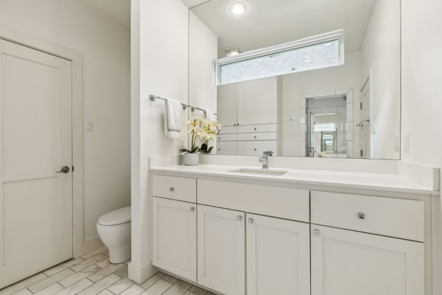 bathroom with vanity and toilet