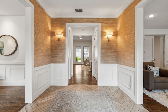 hall with ornamental molding and parquet floors