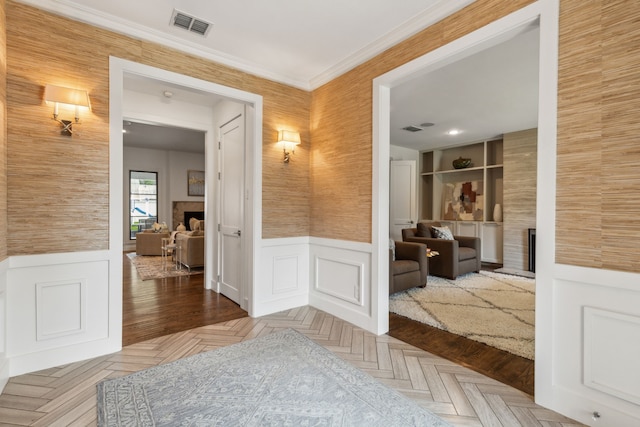 hallway with parquet floors and crown molding