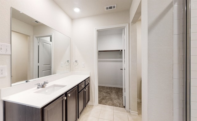 bathroom with vanity and tile patterned flooring