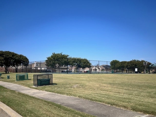 view of property's community with a lawn