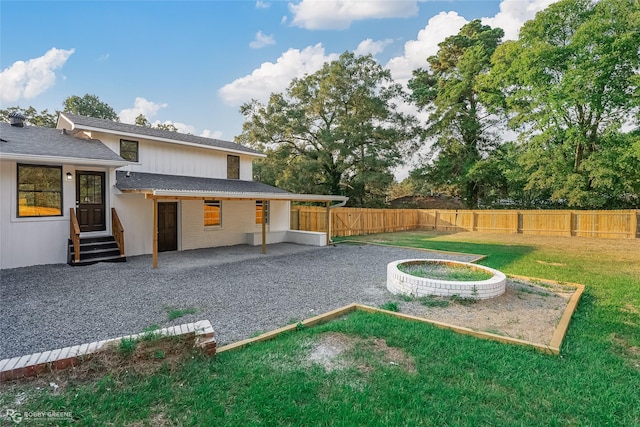 exterior space with a patio area and a yard