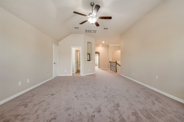 carpeted empty room with lofted ceiling and ceiling fan