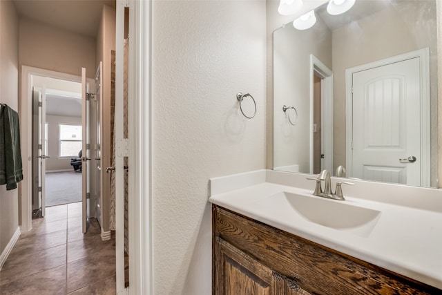 bathroom featuring tile patterned floors and vanity