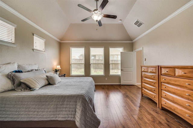 bedroom with ceiling fan, dark hardwood / wood-style floors, vaulted ceiling, and multiple windows