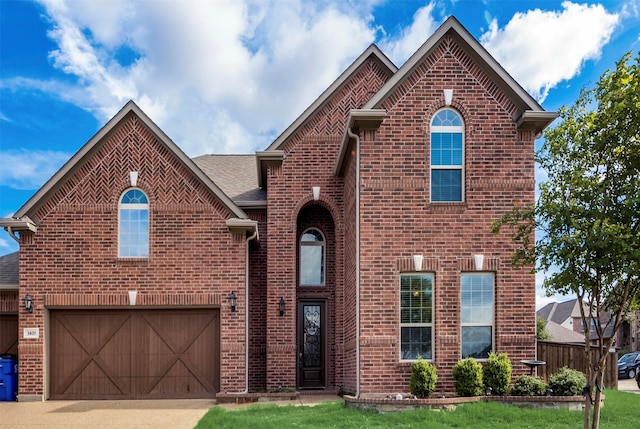 front of property featuring a garage and a front lawn