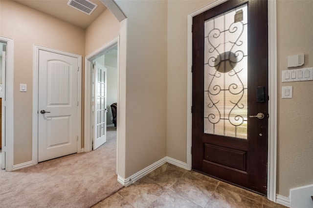 entryway with light carpet