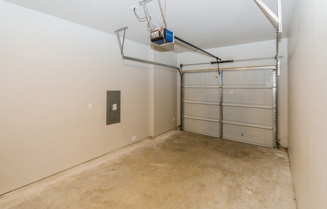 garage featuring a garage door opener and electric panel