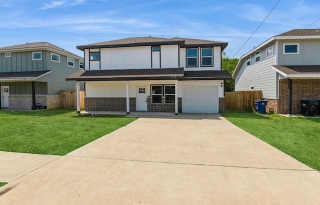 view of front of property with a front yard and a garage