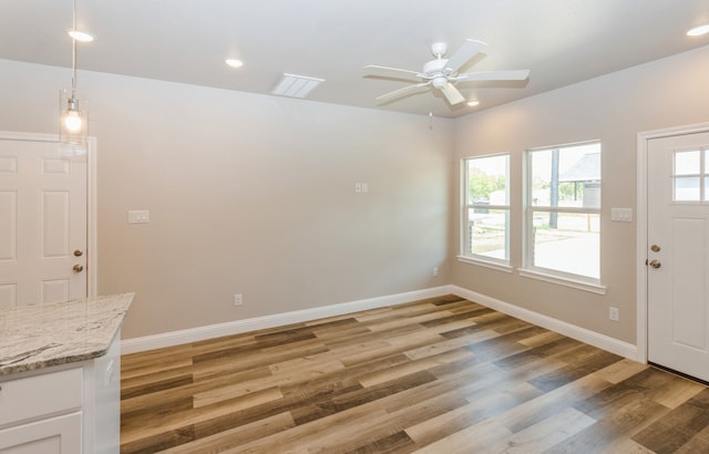 interior space featuring light wood-type flooring and ceiling fan