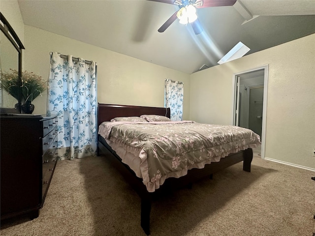 bedroom featuring carpet floors, lofted ceiling, and ceiling fan