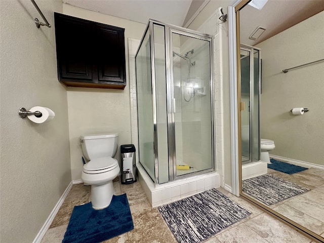 bathroom with tile patterned flooring, toilet, and an enclosed shower