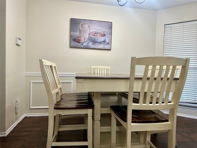 dining area with dark hardwood / wood-style floors